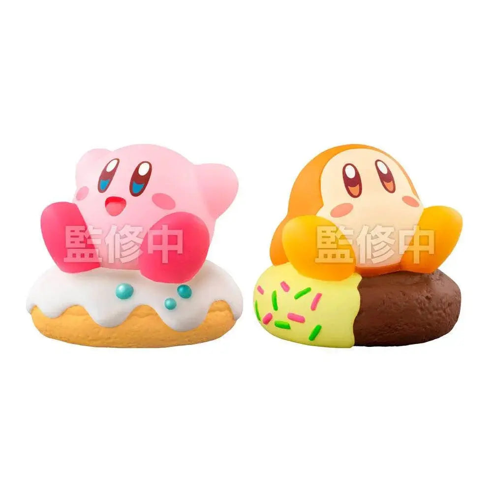 Figure di Kirby e Waddle Dee seduti su dolci colorati, merchandise Nerdscape