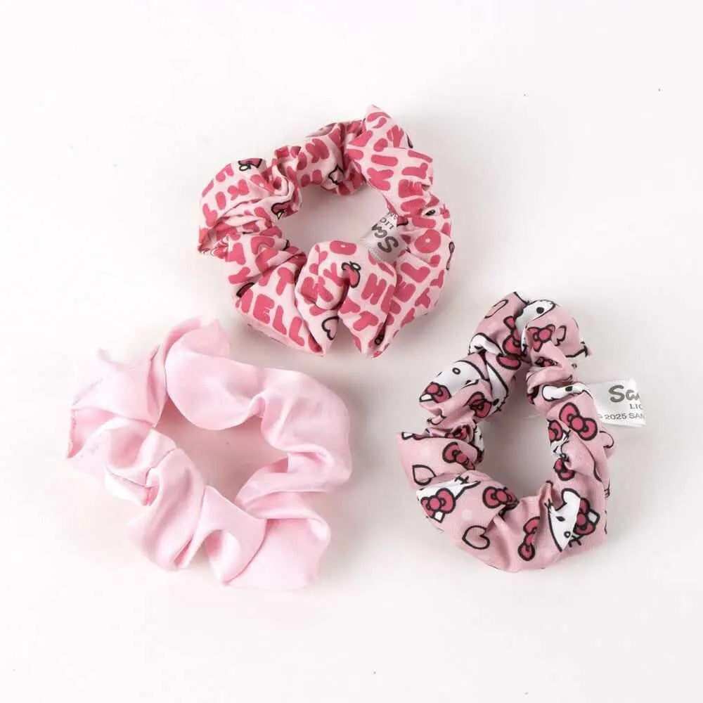 Set di tre elastici rosa Nerdscape con stampe Hello Kitty su sfondo bianco.