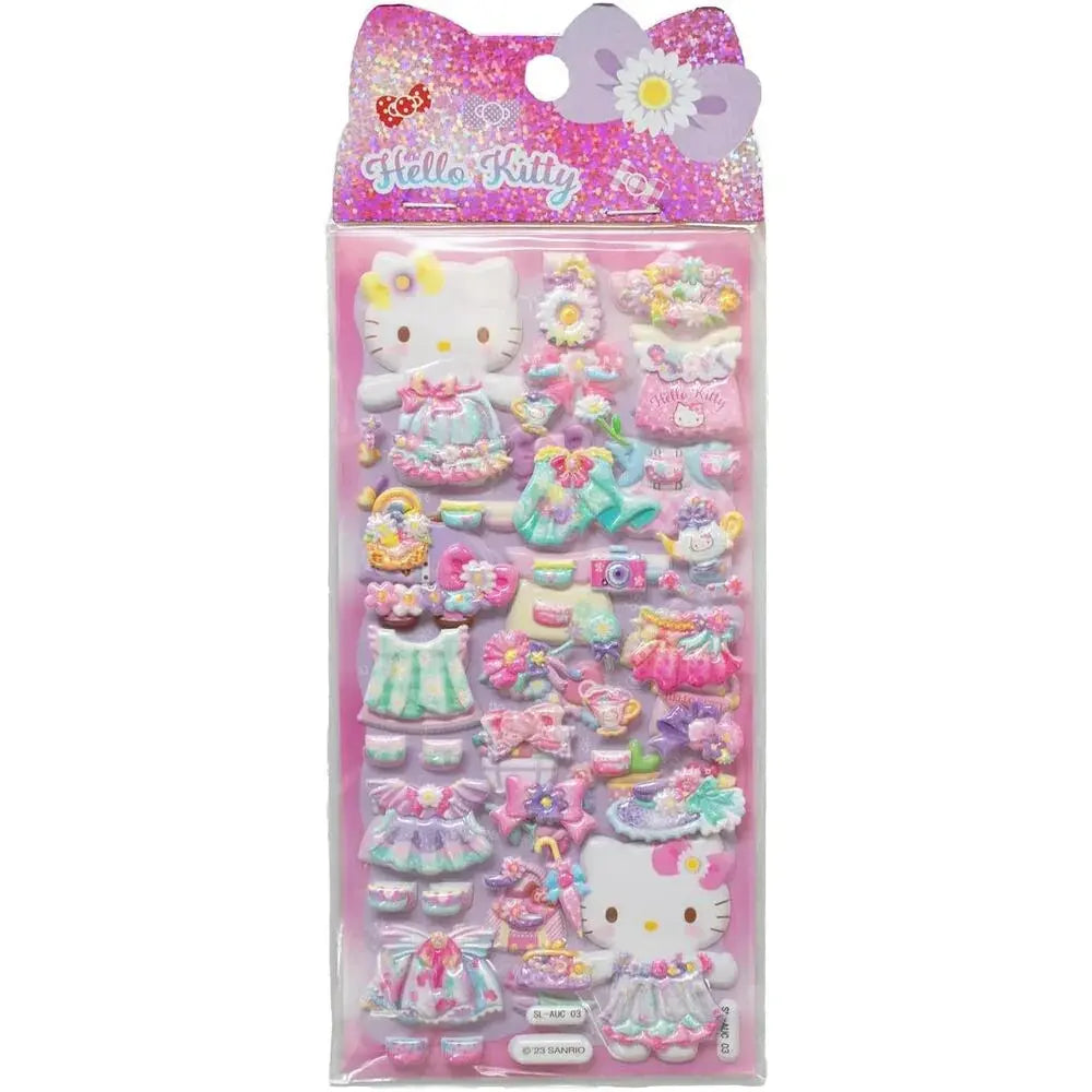 Adesivi 3D Hello Kitty colorati, vestiti e accessori kawaii, confezione su sfondo rosa Nerdscape