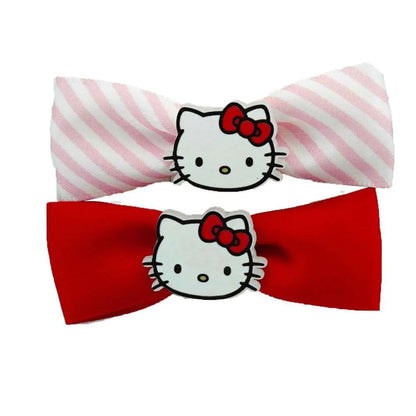 Fermagli per capelli Nerdscape con faccia Hello Kitty, fiocco rosa a righe e fiocco rosso.