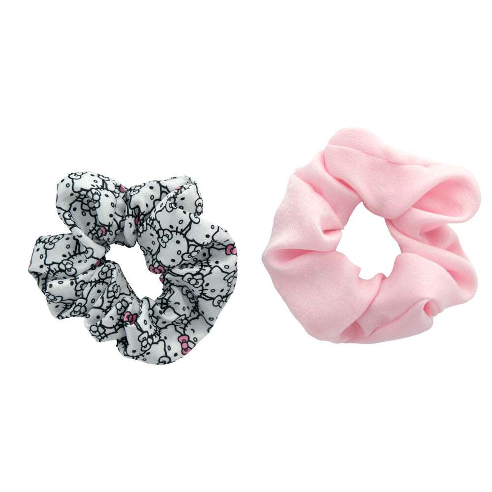 Elastici per capelli Nerdscape: uno rosa e uno bianco con motivo personaggio, su sfondo bianco.