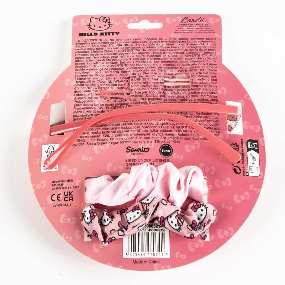 Set accessori capelli Hello Kitty rosa su confezione con logo Sanrio e sfondo rosa, Nerdscape.